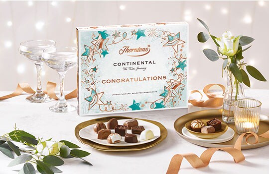 https://www.thorntons.com/medias/sys_master/root/h3f/h8b/8804612898846/2022-conti-mdw-giftideas-congratulations-sleeve-land-small-0.5x_2647/2022-conti-mdw-giftideas-congratulations-sleeve-land-small-0.5x-2647.jpg?resize=FerreroCardsCarouselComponent