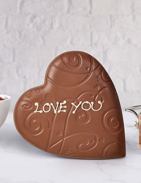 Thorntons milk chocolate heart with &apos;I Love You&apos; hand iced on it