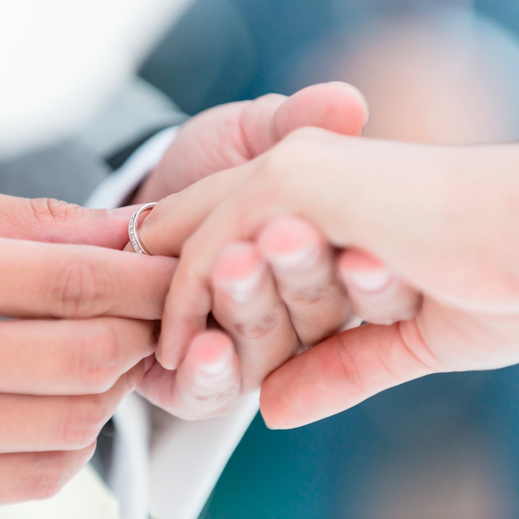 Man putting ring on finger