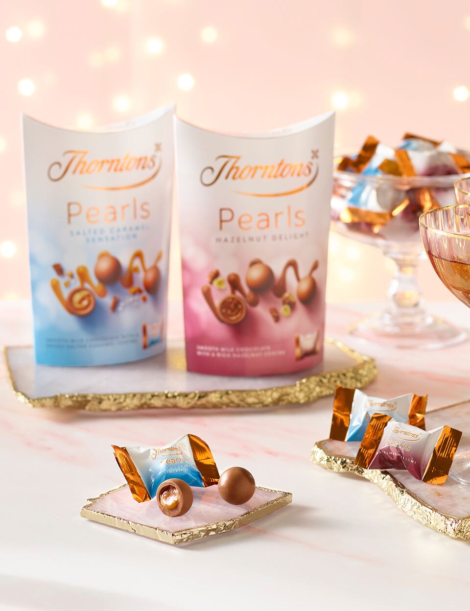 Thorntons Pearls hazelnut and salted caramel on a table dressed
